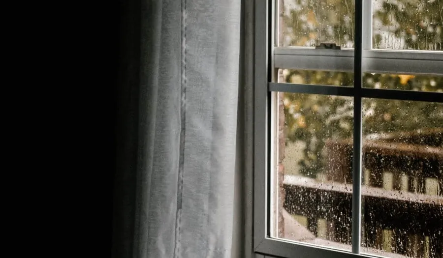 timber sash window in the rain