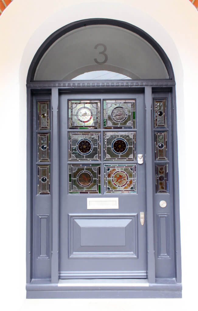 wooden front door with ornaments